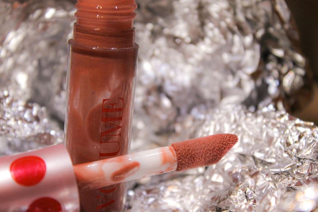 a close up of a lipstick on a piece of tin foil